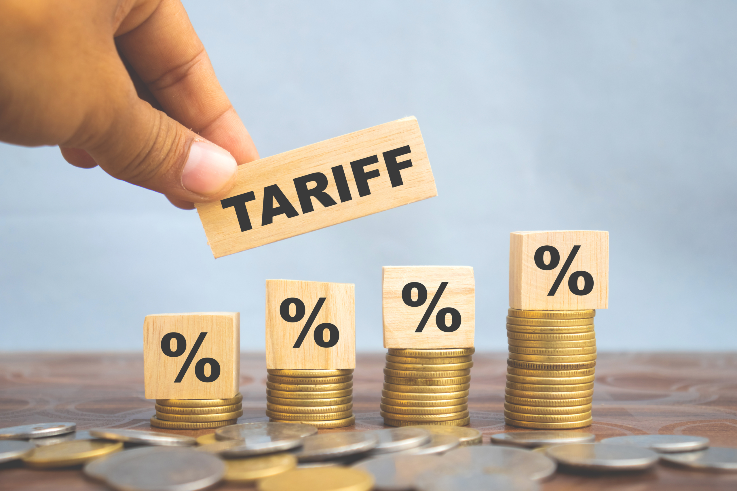 Tariff text on wooden cube with percentage rise
